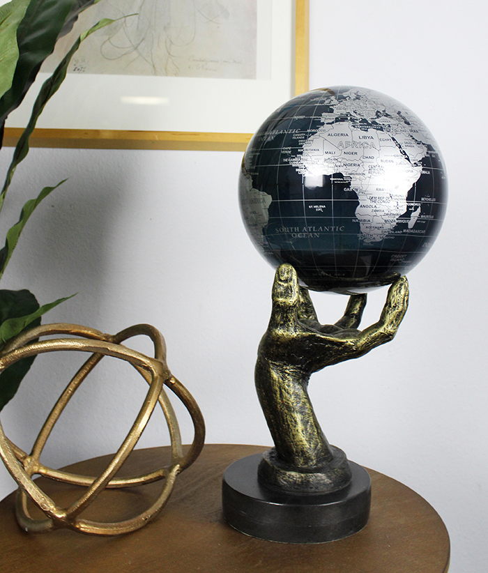 black and silver mova globe being used in the two item rule